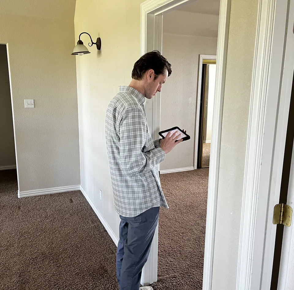 Brian North, Senior Vice President of Growth and Certified Residential Appraiser, capturing inspection data on a tablet