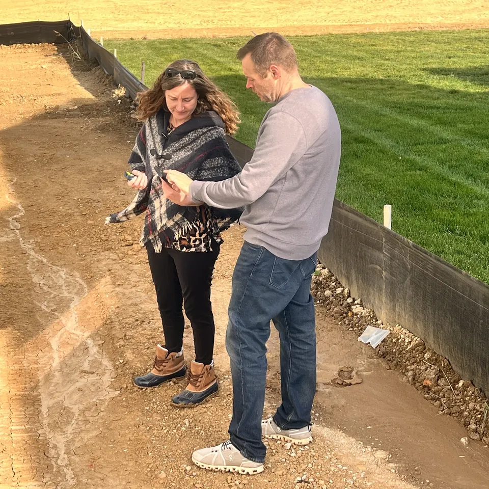 RSDS appraisers measuring a property on site, the kind of data capture UAD 3.6 standardizes