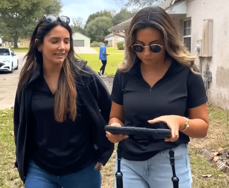 Two RSDS appraisers reviewing a property inspection on a tablet
